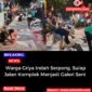 Warga Griya Indah Serpong sedang melukis jalan menjadi perlombaan.